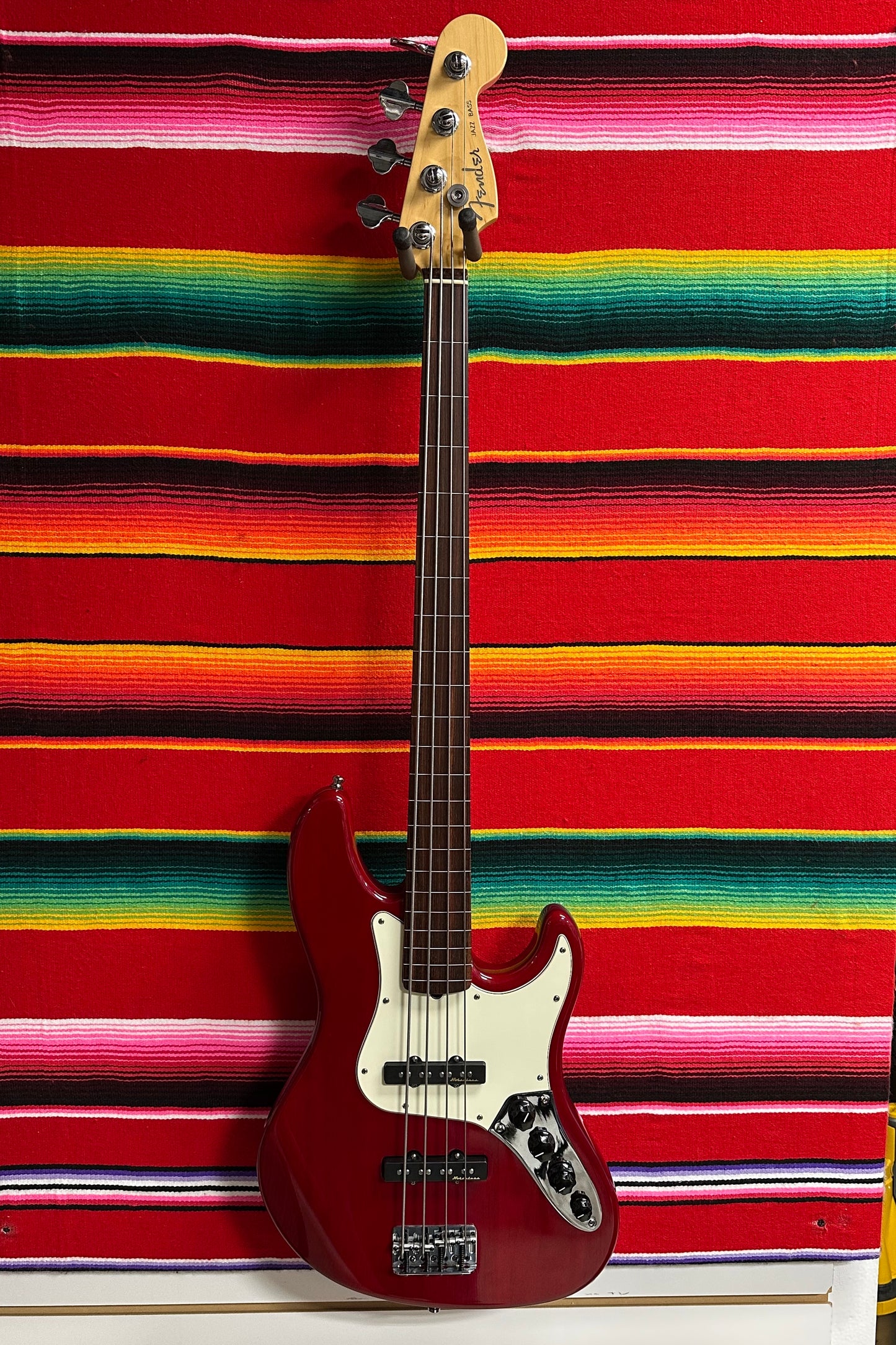 Fender American Deluxe Jazz Bass Fretless Crimson Red Transparent (1999)