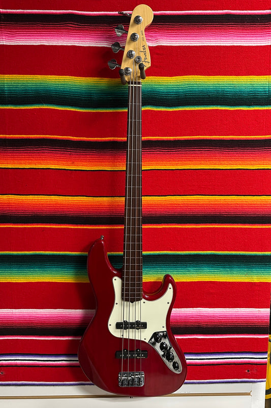 Fender American Deluxe Jazz Bass Fretless Crimson Red Transparent (1999)