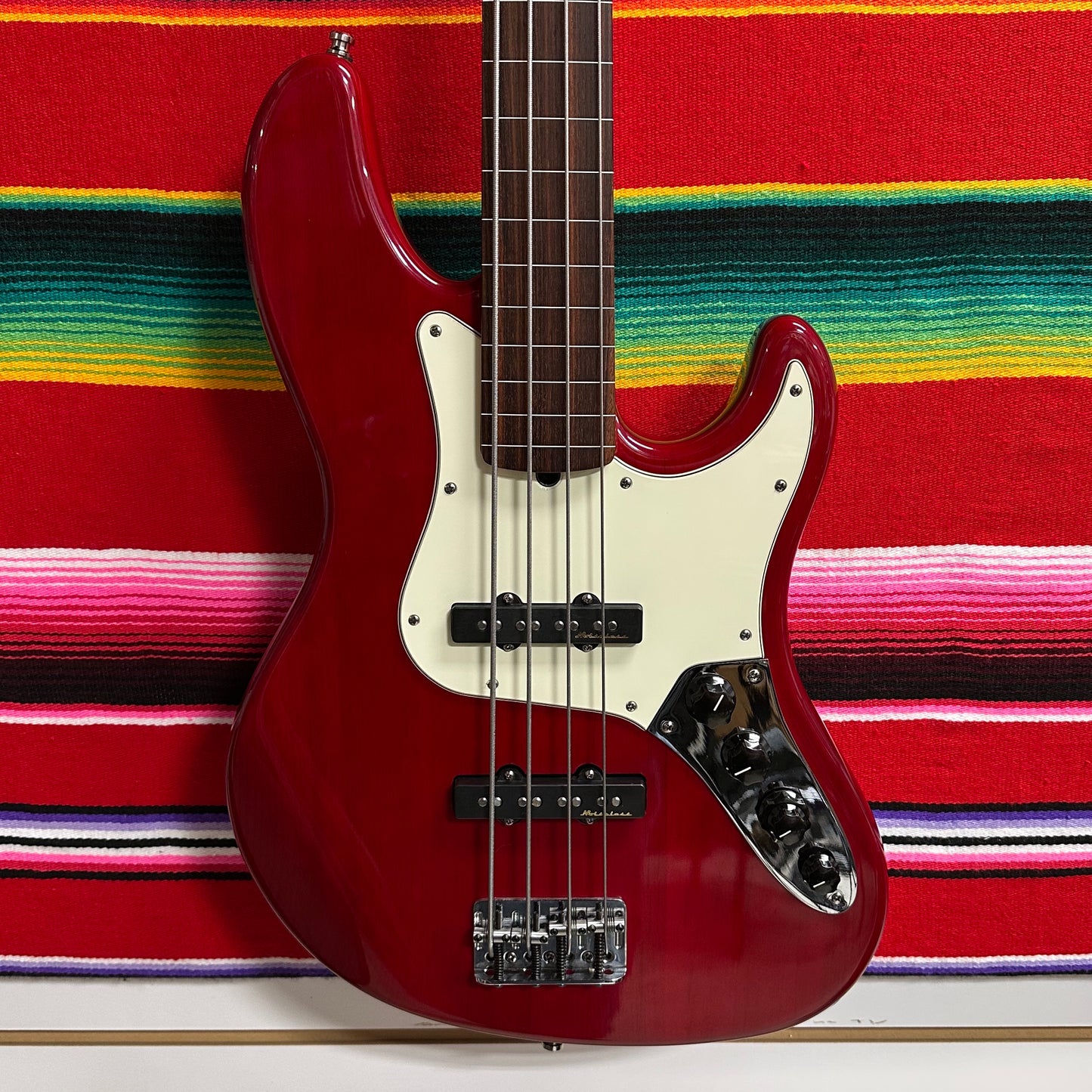 Fender American Deluxe Jazz Bass Fretless Crimson Red Transparent (1999)