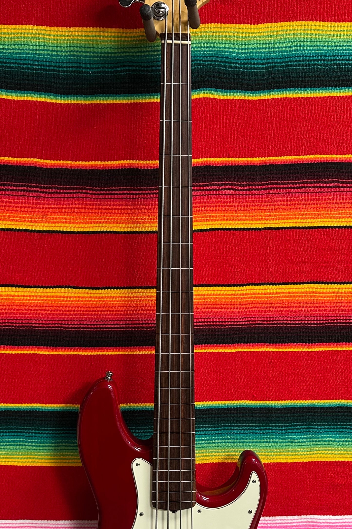 Fender American Deluxe Jazz Bass Fretless Crimson Red Transparent (1999)